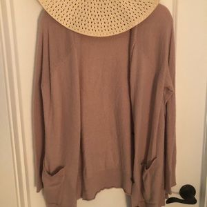 Soft blush sweater with brown buttons
